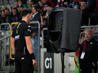 Referee Patryk Gryckiewicz checks the VAR screen during a game between KS Cracovia and Stal Mielec in Krakow, Poland, on September 30, 2024....