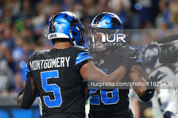 DETROIT,MICHIGAN-September 30: Detroit Lions running back Jahmyr Gibbs (26) celebrates his touchdown with teammate running back David Montgo...