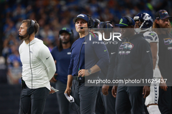 DETROIT,MICHIGAN-September 30: Seattle Seahawks head coach Mike Macdonald follows the play during the first half of an NFL football game bet...