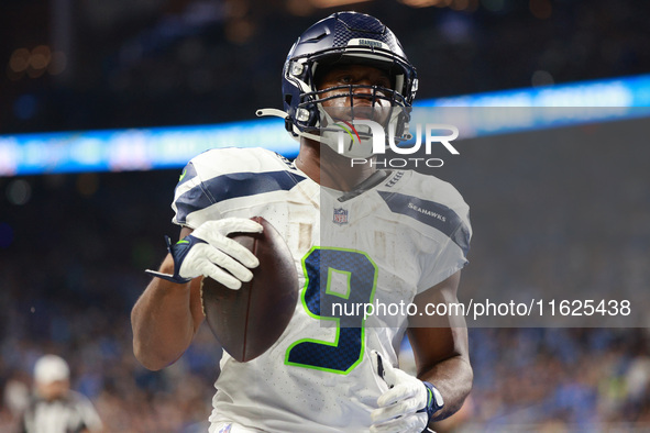 DETROIT,MICHIGAN-September 30: Seattle Seahawks running back Kenneth Walker III (9) scores a touchdown during the first half of an NFL footb...