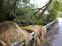 Hay bails lay atop a roadway guardrail in Chilhowie, Virginia on September 30, 2024, after Hurricane Helene caused severe flooding in the re...