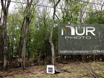 Debris is scattered in Chilhowie, Virginia on September 30, 2024, after Hurricane Helene caused the South Fork Holston River to overflow. (