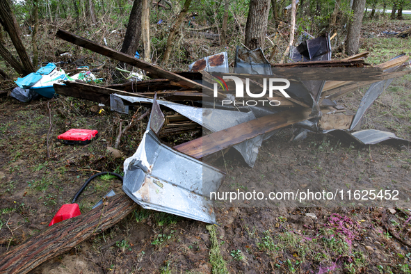 Debris is scattered in Chilhowie, Virginia on September 30, 2024, after Hurricane Helene caused the South Fork Holston River to overflow. 