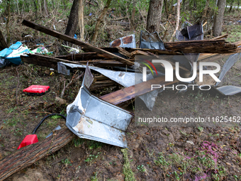 Debris is scattered in Chilhowie, Virginia on September 30, 2024, after Hurricane Helene caused the South Fork Holston River to overflow. (