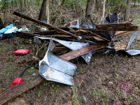 Debris is scattered in Chilhowie, Virginia on September 30, 2024, after Hurricane Helene caused the South Fork Holston River to overflow. (