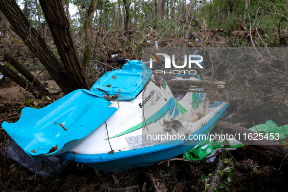 A jet ski sits in the woods in Chilhowie, Virginia on September 30, 2024 after Hurricane Helene flooded the South Fork Holston River several...