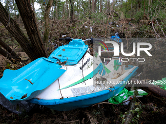 A jet ski sits in the woods in Chilhowie, Virginia on September 30, 2024 after Hurricane Helene flooded the South Fork Holston River several...