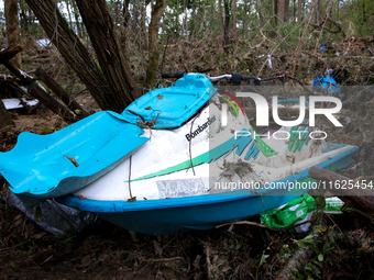 A jet ski sits in the woods in Chilhowie, Virginia on September 30, 2024 after Hurricane Helene flooded the South Fork Holston River several...