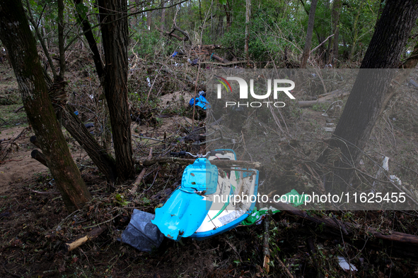 A jet ski sits in the woods in Chilhowie, Virginia on September 30, 2024 after Hurricane Helene flooded the South Fork Holston River several...