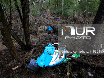 A jet ski sits in the woods in Chilhowie, Virginia on September 30, 2024 after Hurricane Helene flooded the South Fork Holston River several...