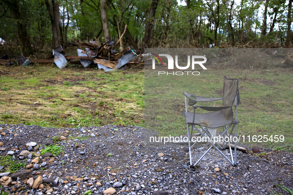 Debris is scattered in Chilhowie, Virginia on September 30, 2024, after Hurricane Helene caused the South Fork Holston River to overflow. 