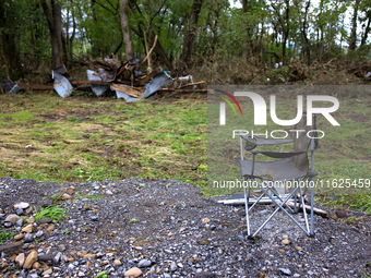 Debris is scattered in Chilhowie, Virginia on September 30, 2024, after Hurricane Helene caused the South Fork Holston River to overflow. (