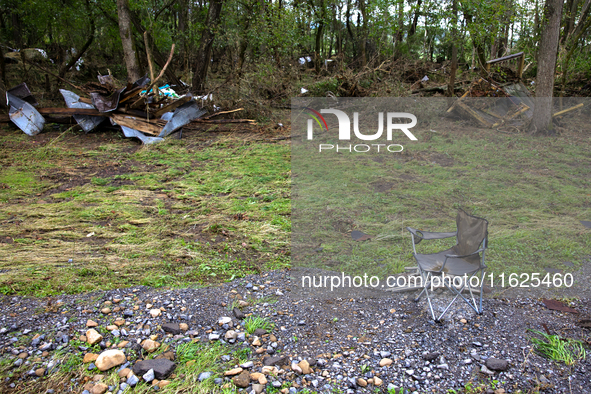 Debris is scattered in Chilhowie, Virginia on September 30, 2024, after Hurricane Helene caused the South Fork Holston River to overflow. 