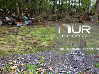 Debris is scattered in Chilhowie, Virginia on September 30, 2024, after Hurricane Helene caused the South Fork Holston River to overflow. (