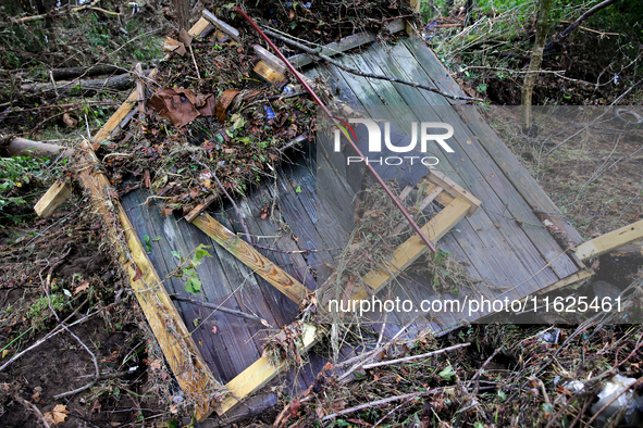 Debris is scattered in Chilhowie, Virginia on September 30, 2024, after Hurricane Helene caused the South Fork Holston River to overflow. 