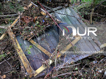 Debris is scattered in Chilhowie, Virginia on September 30, 2024, after Hurricane Helene caused the South Fork Holston River to overflow. (