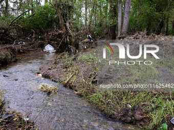 Debris is scattered in Chilhowie, Virginia on September 30, 2024, after Hurricane Helene caused the South Fork Holston River to overflow. (