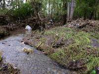 Debris is scattered in Chilhowie, Virginia on September 30, 2024, after Hurricane Helene caused the South Fork Holston River to overflow. (