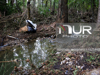 Debris is scattered in Chilhowie, Virginia on September 30, 2024, after Hurricane Helene caused the South Fork Holston River to overflow. (