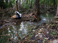 Debris is scattered in Chilhowie, Virginia on September 30, 2024, after Hurricane Helene caused the South Fork Holston River to overflow. (