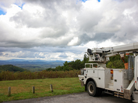 A utility vehicle is seen parked at an overlook in the Appalachian mountains near Whitetop, Virginia on September 30, 2024 as crews work to...