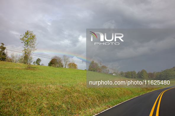 A rainbow is seen over a hilltop in Whitetop, Virginia on September 30, 2024 after Hurricane Helene caused damage in the region several days...