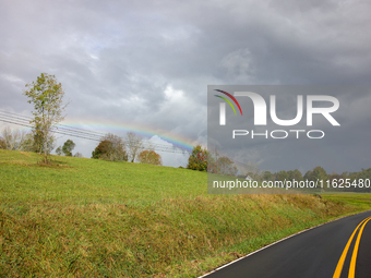 A rainbow is seen over a hilltop in Whitetop, Virginia on September 30, 2024 after Hurricane Helene caused damage in the region several days...