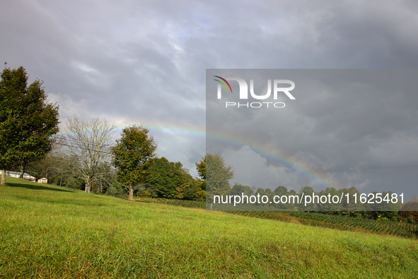 A rainbow is seen over a hilltop in Whitetop, Virginia on September 30, 2024 after Hurricane Helene caused damage in the region several days...