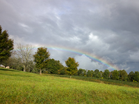 A rainbow is seen over a hilltop in Whitetop, Virginia on September 30, 2024 after Hurricane Helene caused damage in the region several days...