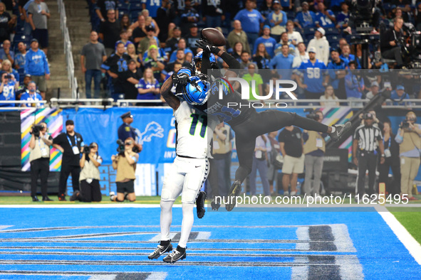 DETROIT,MICHIGAN-September 30: Detroit Lions safety Kerby Joseph (31) intercepts a pass intended for Seattle Seahawks wide receiver Jaxon Sm...