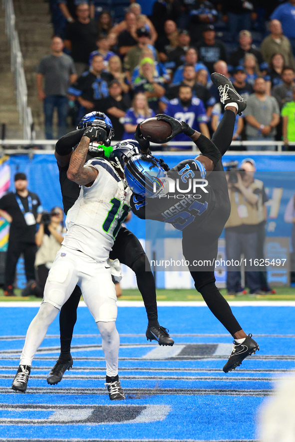 DETROIT,MICHIGAN-September 30: Detroit Lions safety Kerby Joseph (31) intercepts a pass intended for Seattle Seahawks wide receiver Jaxon Sm...