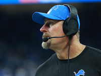 DETROIT,MICHIGAN-September 30: Detroit Lions head coach Dan Campbell follows the play during the second half of an NFL football game between...