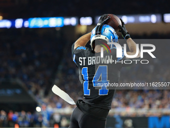 DETROIT,MICHIGAN-September 30: Detroit Lions wide receiver Amon-Ra St. Brown (14) catches a pass for a touchdown during the second half of a...