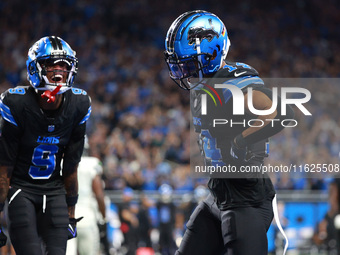 DETROIT,MICHIGAN-September 30: Detroit Lions wide receiver Amon-Ra St. Brown (14) celebrates his touchdown with teammate wide receiver James...