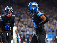 DETROIT,MICHIGAN-September 30: Detroit Lions wide receiver Amon-Ra St. Brown (14) celebrates his touchdown with teammate wide receiver James...