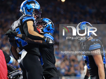 DETROIT,MICHIGAN-September 30: Detroit Lions wide receiver Amon-Ra St. Brown (14) celebrates his touchdown with teammate wide receiver James...