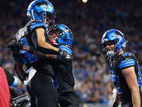 DETROIT,MICHIGAN-September 30: Detroit Lions wide receiver Amon-Ra St. Brown (14) celebrates his touchdown with teammate wide receiver James...