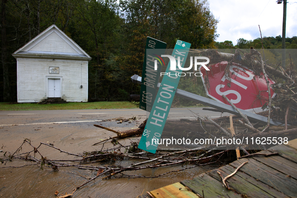 Street signs lay toppled in Lansing, North Carolina on September 30, 2024 after Hurricane Helene caused widespread damage in the region. 