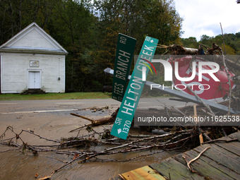 Street signs lay toppled in Lansing, North Carolina on September 30, 2024 after Hurricane Helene caused widespread damage in the region. (