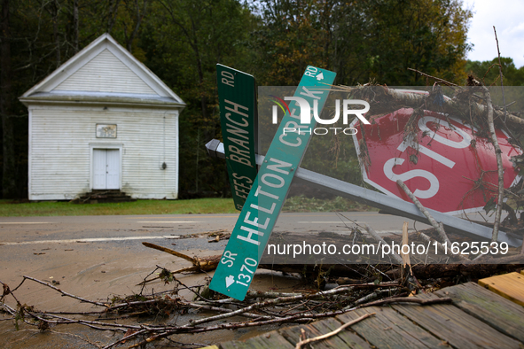 Street signs lay toppled in Lansing, North Carolina on September 30, 2024 after Hurricane Helene caused widespread damage in the region. 