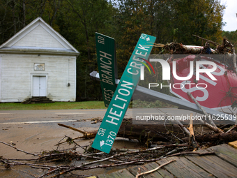 Street signs lay toppled in Lansing, North Carolina on September 30, 2024 after Hurricane Helene caused widespread damage in the region. (