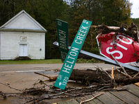 Street signs lay toppled in Lansing, North Carolina on September 30, 2024 after Hurricane Helene caused widespread damage in the region. (