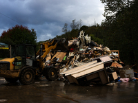 A bulldozer piles collected debris in Lansing, North Carolina on September 30, 2024 after Hurricane Helene caused widespread damage to the r...