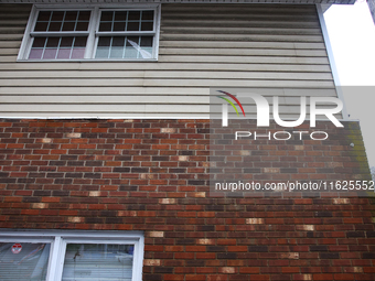 Water damage is seen on the brick facade of the Lansing Volunteer Fire Department in Lansing, North Carolina on September 30, 2024 after Hur...