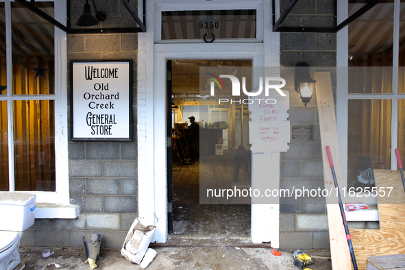 A sign at a business in Lansing, North Carolina instructs people not to enter or remove items on September 30, 2024 after Hurricane Helene c...