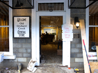 A sign at a business in Lansing, North Carolina instructs people not to enter or remove items on September 30, 2024 after Hurricane Helene c...