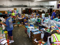 People collect donations at the Lansing Volunteer Fire Department in Lansing, North Carolina on September 30, 2024, after Hurricane Helene c...