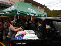 Volunteers collect donations at the Lansing Volunteer Fire Department in Lansing, North Carolina on September 30, 2024, after Hurricane Hele...