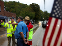 Volunteers collect donations at the Lansing Volunteer Fire Department in Lansing, North Carolina on September 30, 2024, after Hurricane Hele...