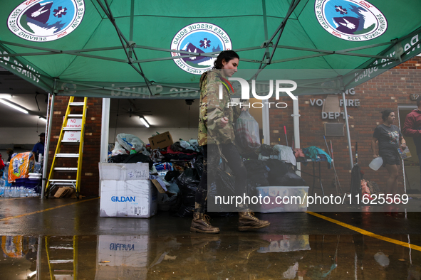 Volunteers collect donations at the Lansing Volunteer Fire Department in Lansing, North Carolina on September 30, 2024, after Hurricane Hele...